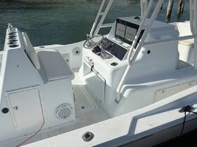 A clean and modern helm area of a boat featuring seating and navigation equipment, ideal for fishing or cruising adventures.