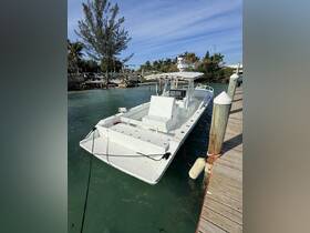 A sleek speedboat docked at the marina, showcasing its spacious deck and modern design, perfect for fishing or day trips on the water.