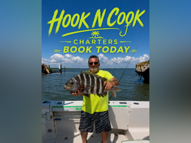 A proud angler displays his impressive catch aboard a charter boat, showcasing the excitement of a fishing adventure. Book your own fishing experience today!
