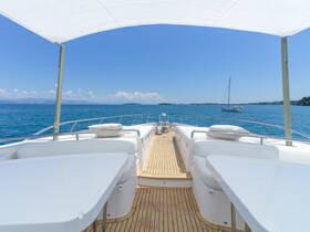 A stunning view from the deck of a yacht, showcasing the serene blue waters and distant islands — perfect for a relaxing day on the water.