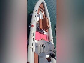 Interior view of a spacious inflatable boat featuring comfortable seating and a helm, perfect for day trips on the water.