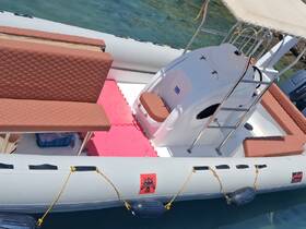 Interior view of a well-equipped boat featuring comfortable seating and a helm area, perfect for a day on the water.