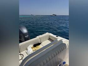 Interior view of a boat's seating area, showcasing a clean and comfortable space ideal for relaxation while enjoying the water.