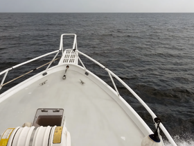 A clear view from the front of a boat, showcasing the vessel's structure against the calm sea — perfect for showcasing boat designs or cruising experiences.