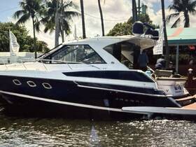 A regal yacht docked at a marina, showcasing its sleek design and inviting atmosphere, perfect for luxury outings on the water.