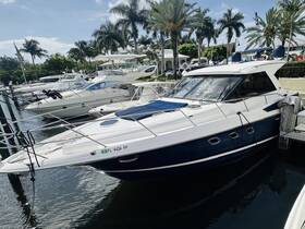 A sleek yacht docked at a marina, surrounded by palm trees and other vessels, showcasing the perfect setting for luxury boating experiences.