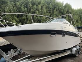 A sleek powerboat is showcased on a trailer, highlighting its elegant design and features, perfect for water adventures.