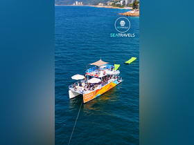 A vibrant party atmosphere aboard the 'Tequila Sunrise' boat, with guests enjoying the sun and sea — perfect for group celebrations and fun on the water.