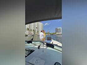 A couple shares a romantic moment on a boat, perfect for celebrations and special occasions on the water.
