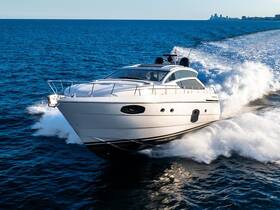 A stunning yacht cuts through the waves, showcasing its sleek design and powerful performance on the open water.