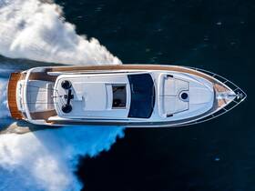 A stunning aerial view of a sleek speedboat cutting through the water, showcasing its elegant design and powerful performance.