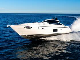A sleek speedboat cuts through the clear blue waters, showcasing its elegant design and powerful performance — perfect for thrilling adventures on the open sea.