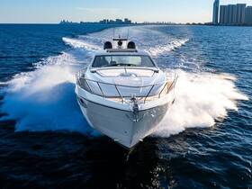 A stunning aerial view of a sleek speedboat cutting through the waves, showcasing its elegant design and performance on the water.
