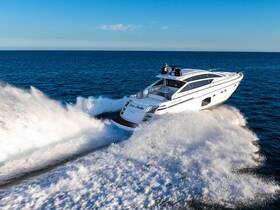 A stunning aerial view of a sleek speedboat cutting through the waves, showcasing its dynamic design and performance on the open water.