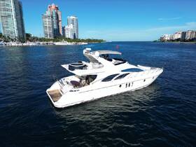 A stunning yacht cruising through clear waters, with a backdrop of modern skyscrapers, perfect for luxury outings and scenic views.