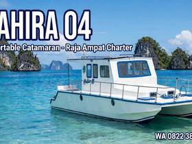 A stunning catamaran named 'Sahira 04' docked in the crystal-clear waters of Raja Ampat, perfect for charters and exploring the breathtaking scenery of this tropical paradise.