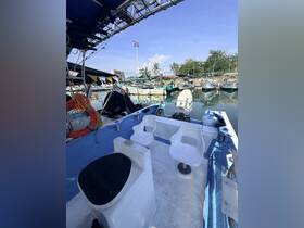 Interior view of a boat showcasing seating and helm area, perfect for fishing trips or leisurely cruises.