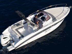Aerial view of a sleek speedboat in motion, showcasing its elegant design and features, perfect for thrilling water adventures.