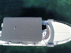 Aerial view of a sleek boat showcasing its elegant design and spacious deck, perfect for enjoying time on the water.