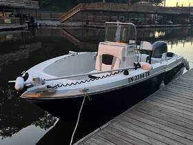 A sleek Robalo speedboat docked at a marina, showcasing its elegant design and features — perfect for a day on the water.