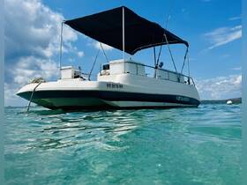 A sleek speedboat anchored in clear turquoise waters, perfect for a day of adventure on the sea.