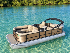 A beautiful pontoon boat anchored in crystal-clear waters, showcasing its spacious seating and sleek design — perfect for leisurely outings on the water.
