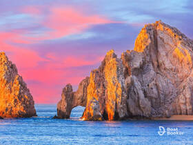 Stunning view of iconic rock formations at sunset, showcasing the natural beauty of the coastline — a must-see landmark for boat tours.