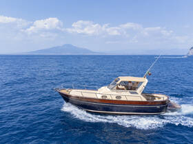 A beautiful yacht cruising through the azure waters, with the iconic Mount Vesuvius in the background, perfect for exploring the stunning coastline.