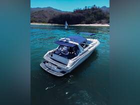 A stunning aerial view of a sleek yacht cruising through clear waters, showcasing its elegant design and perfect for luxurious outings.
