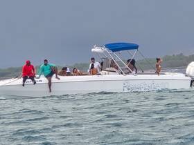 A lively group enjoys their time aboard a boat, showcasing the fun and excitement of a day on the water.