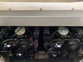 Detailed view of a boat's engine compartment, showcasing the mechanical components essential for vessel operation.