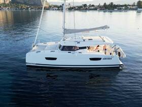 A stunning aerial view of a catamaran docked in calm waters, showcasing its sleek design and inviting atmosphere, perfect for leisurely sailing adventures.