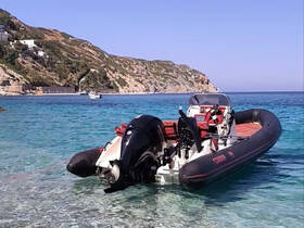 A sleek speedboat docked in crystal-clear waters, surrounded by scenic coastal hills — perfect for exploring the beautiful coastline.