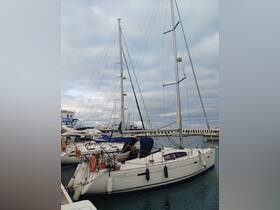 A sleek Oceanis 40 yacht docked at the marina, showcasing its elegant design and ready for sailing adventures.