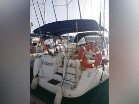 A detailed view of the yacht 'Wagamón' docked at the marina, showcasing its elegant design and features.