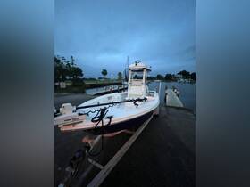 A sleek center console boat is docked at twilight, showcasing its design and readiness for a day on the water.