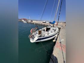 A beautiful yacht docked at the marina, showcasing its sleek design against a clear blue sky — perfect for sailing enthusiasts and charter opportunities.