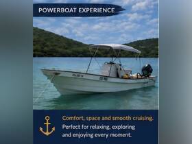 A powerboat anchored in serene waters, perfect for a relaxing day of exploration and smooth cruising. Ideal for those seeking comfort on the water.