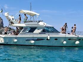 A lively group enjoys a day on a yacht, soaking up the sun and having fun in the water — the perfect setting for summer celebrations.