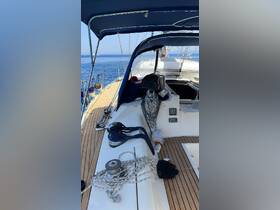 A detailed view of the helm area inside a sailboat, showcasing the console and various sailing equipment, perfect for those interested in nautical adventures.