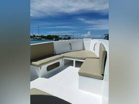 Interior view of a comfortable seating area on a boat, featuring plush cushions and a clean, spacious layout — perfect for relaxing while cruising.