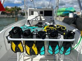 A display of snorkeling gear, including fins and masks, ready for an underwater adventure. Perfect for exploring vibrant marine life.