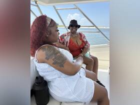 Two friends enjoy a relaxing moment aboard a boat, showcasing the perfect atmosphere for socializing and enjoying the water.