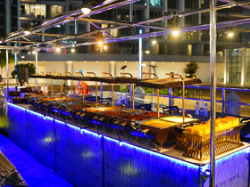 An elegant buffet setup featuring a variety of dishes, perfect for onboard catering during events or celebrations.