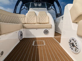 Interior view of a stylish boat cabin featuring plush seating and modern design, perfect for relaxing on the water.