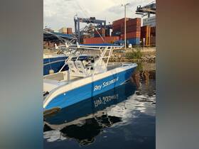 A sleek speedboat named 'Rey Salomón II' docked at a harbor, reflecting beautifully in the calm waters, surrounded by shipping containers.