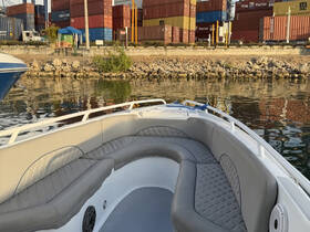 Interior view of a comfortable boat seating area, perfect for relaxing while enjoying the waterfront scenery.