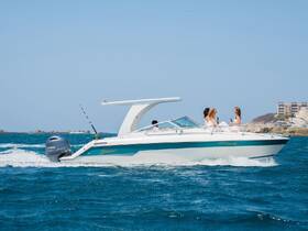 A lively group enjoys drinks aboard a speedboat, perfect for celebrations and fun on the water.