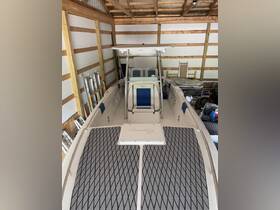 Interior view of a well-maintained boat helm with seating, showcasing the spacious layout ideal for comfortable cruising.