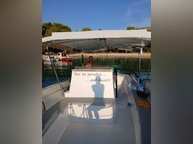 A captain at the helm of a boat, ready to take guests on a journey to paradise. The interior showcases comfortable seating and a welcoming atmosphere for a perfect day on the water.